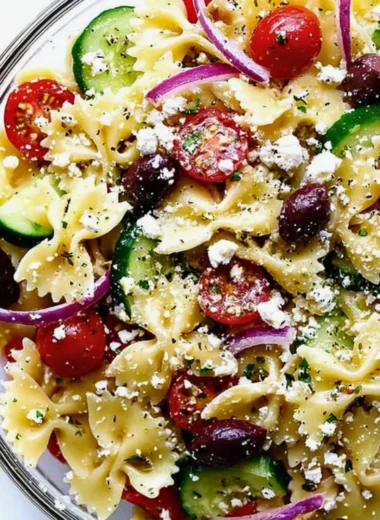 Colorful Mediterranean Pasta Salad with veggies and olives in a bowl