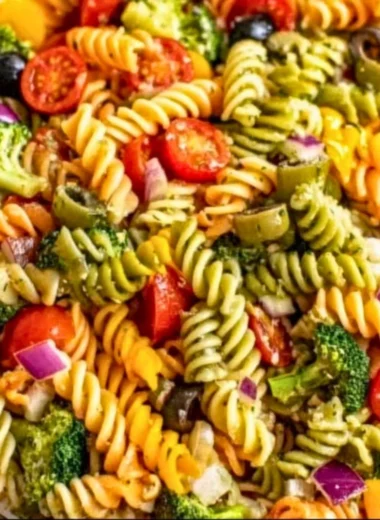 Colorful and fresh pasta salad with vegetables and dressing in a bowl