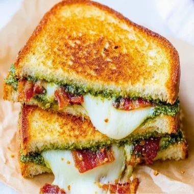 Mouthwatering Pesto Grilled Cheese sandwich with melted cheese and fresh basil pesto