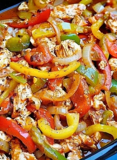 Slow cooker chicken fajitas served with peppers and onions on a plate