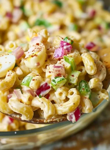 Southern macaroni salad served in a bowl with colorful ingredients