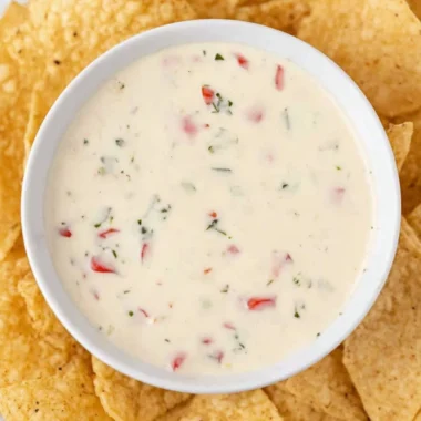 Bowl of creamy Mexican white cheese dip with tortilla chips