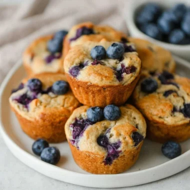Freshly baked blueberry cottage cheese muffins on a rustic table