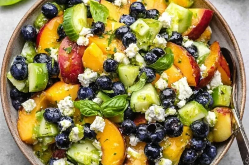 Fresh blueberry peach feta salad with vibrant fruits and creamy feta cheese