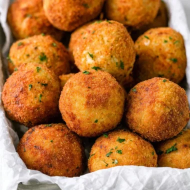 Delicious cheesy rice balls (arancini) served golden and crispy