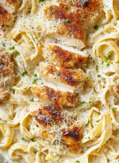 Creamy Chicken Fettuccine Alfredo served in a bowl garnished with parsley
