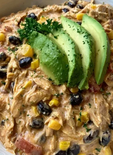 Delicious Crock Pot Fiesta Chicken served with colorful toppings.