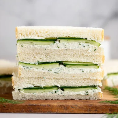 Delicious cucumber sandwich served on a plate, perfect for afternoon tea.