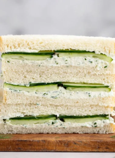 Delicious cucumber sandwich served on a plate, perfect for afternoon tea.