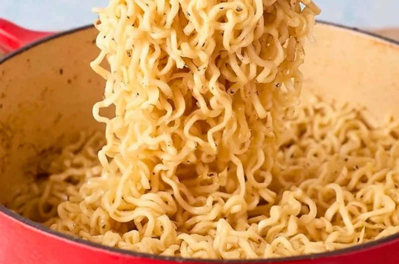 Delicious garlic butter ramen noodles topped with fresh herbs and spices.
