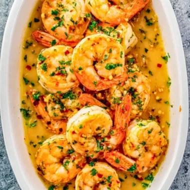 Delicious Garlic Butter Shrimp served with herbs and lemon