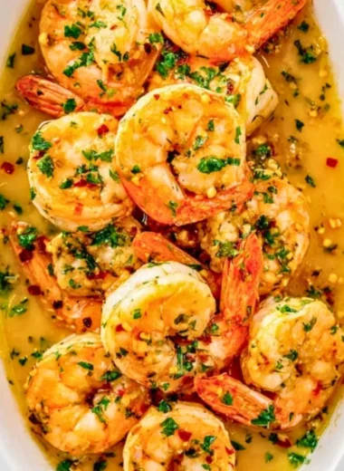 Delicious Garlic Butter Shrimp served with herbs and lemon