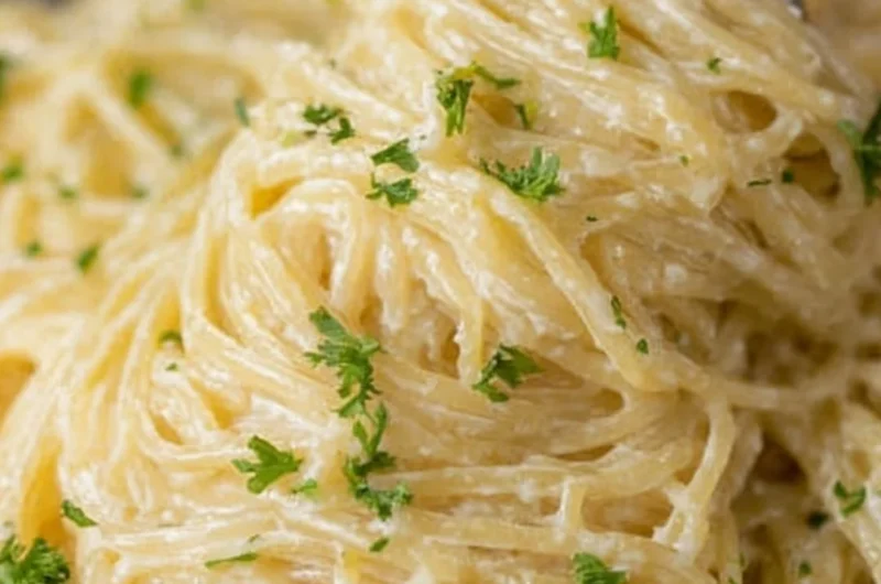 Creamy Garlic Parmesan Pasta with herbs and cheese in a bowl