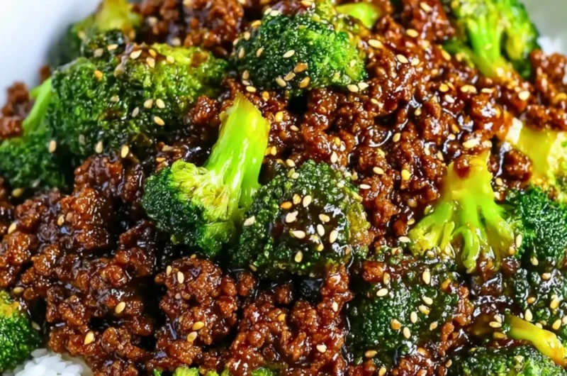 A plate of ground beef and broccoli stir-fry served with rice.