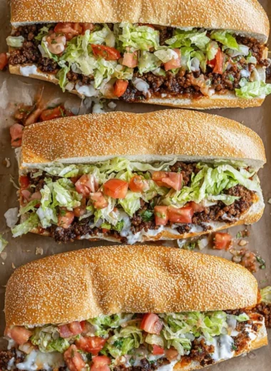 Mexican Chopped Cheese Sandwich garnished with fresh chiles and toppings