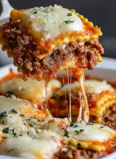 Delicious Million Dollar Ravioli Casserole served in a baking dish with cheese