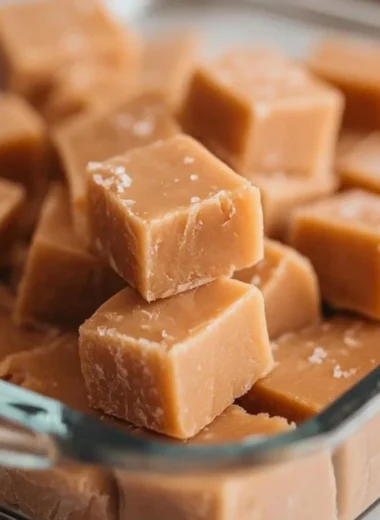 Delicious homemade peanut butter fudge placed on a marble surface.