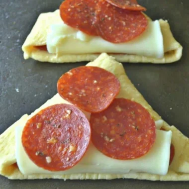 Delicious homemade Pizza Roll-Ups served in a plate with marinara sauce
